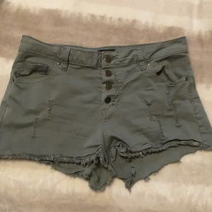 Army green ripped jean shorts